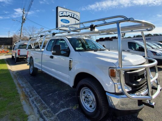 Side angle of a Ford Super Duty work truck featuring a custom overhead aluminum rack.