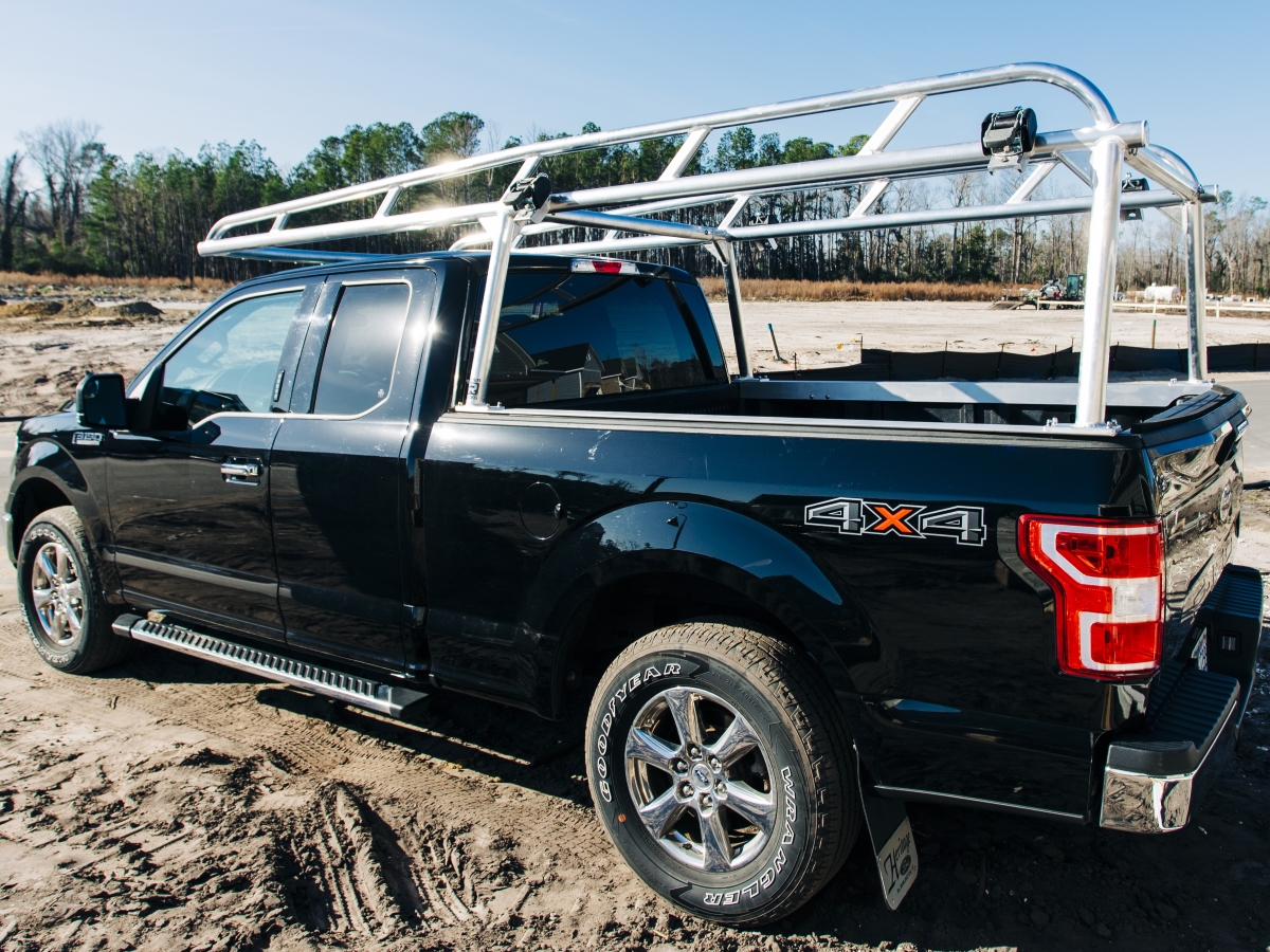 Side angle showing a polished rack mounted on a black Ford F-150.