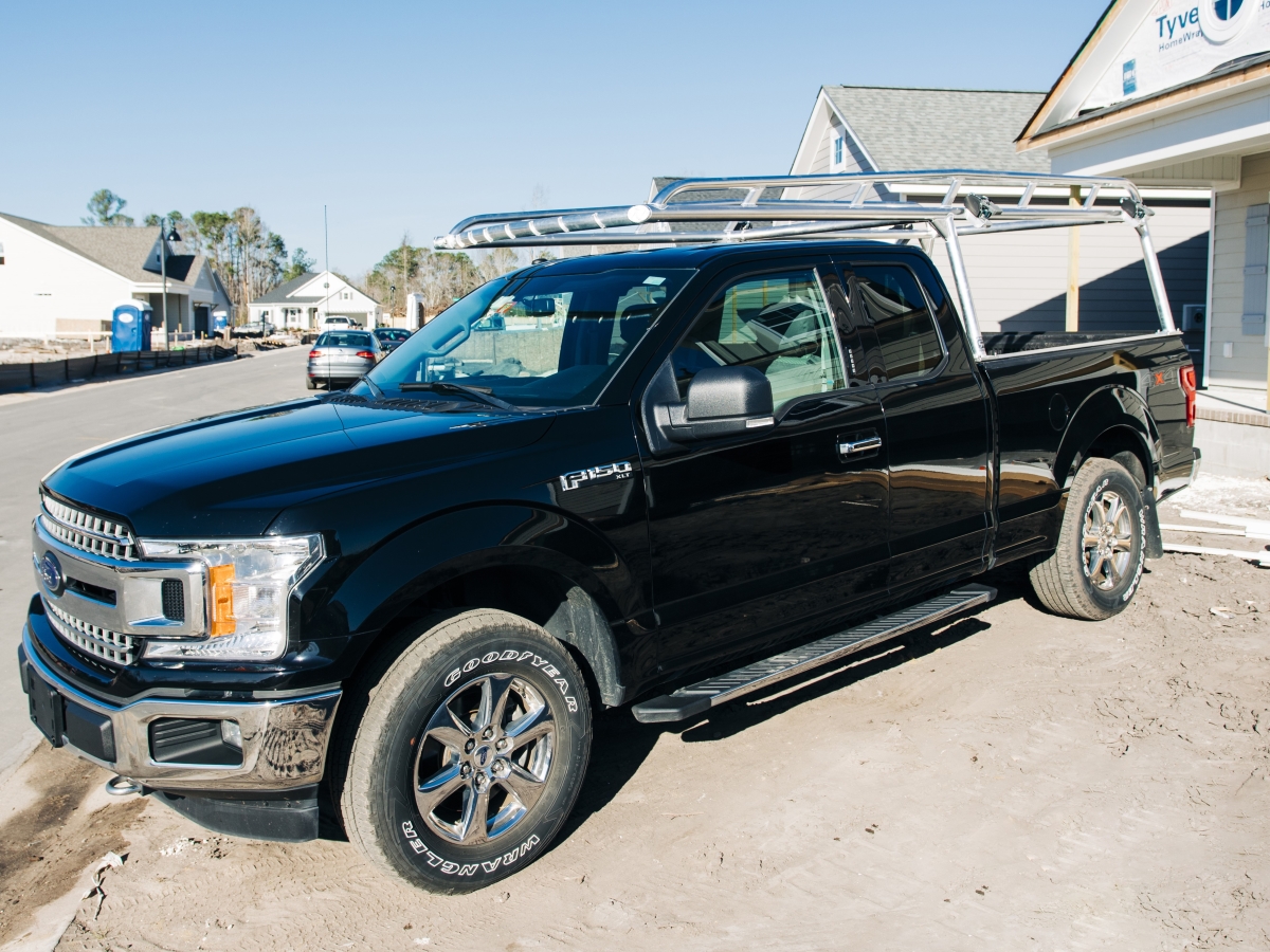 Close angle of a Ford truck with a polished aluminum rack installed.