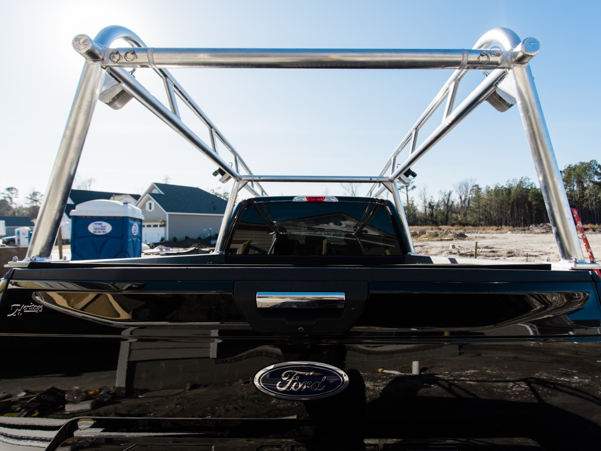 Rear view of the aluminum rack mounted over the truck bed.