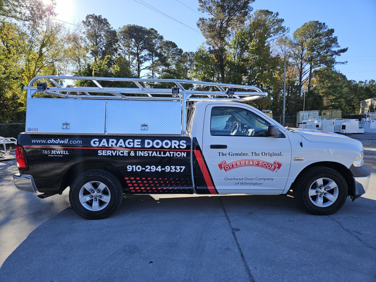Side view of ladder rack and tool box on a Ram contractor truck.