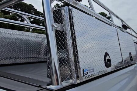 Close-up of the anodized Pro Series rack leg mounted next to the standard topsider tool box.