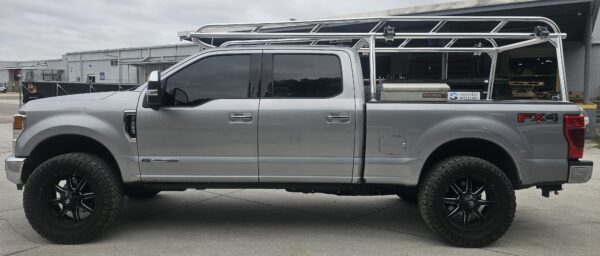 Ford F250 ladder rack with welded rails and a Weather Guard toolbox.