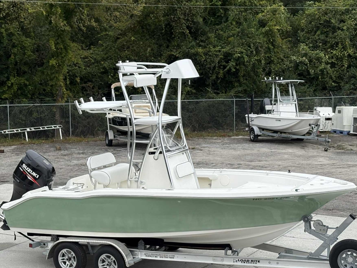 Full side profile of a Key West boat featuring a custom-built aluminum cobia tower.