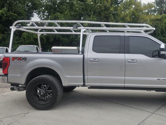 Rear-corner detail of rail geometry and strap mounting points.