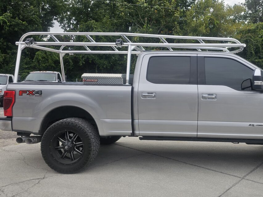 Rear-corner detail of rail geometry and strap mounting points.