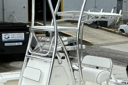 Forward angle of the tower showing the upper control area and matching white vinyl upholstery.