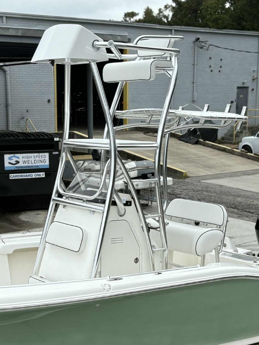 Forward angle of the tower showing the upper control area and matching white vinyl upholstery.