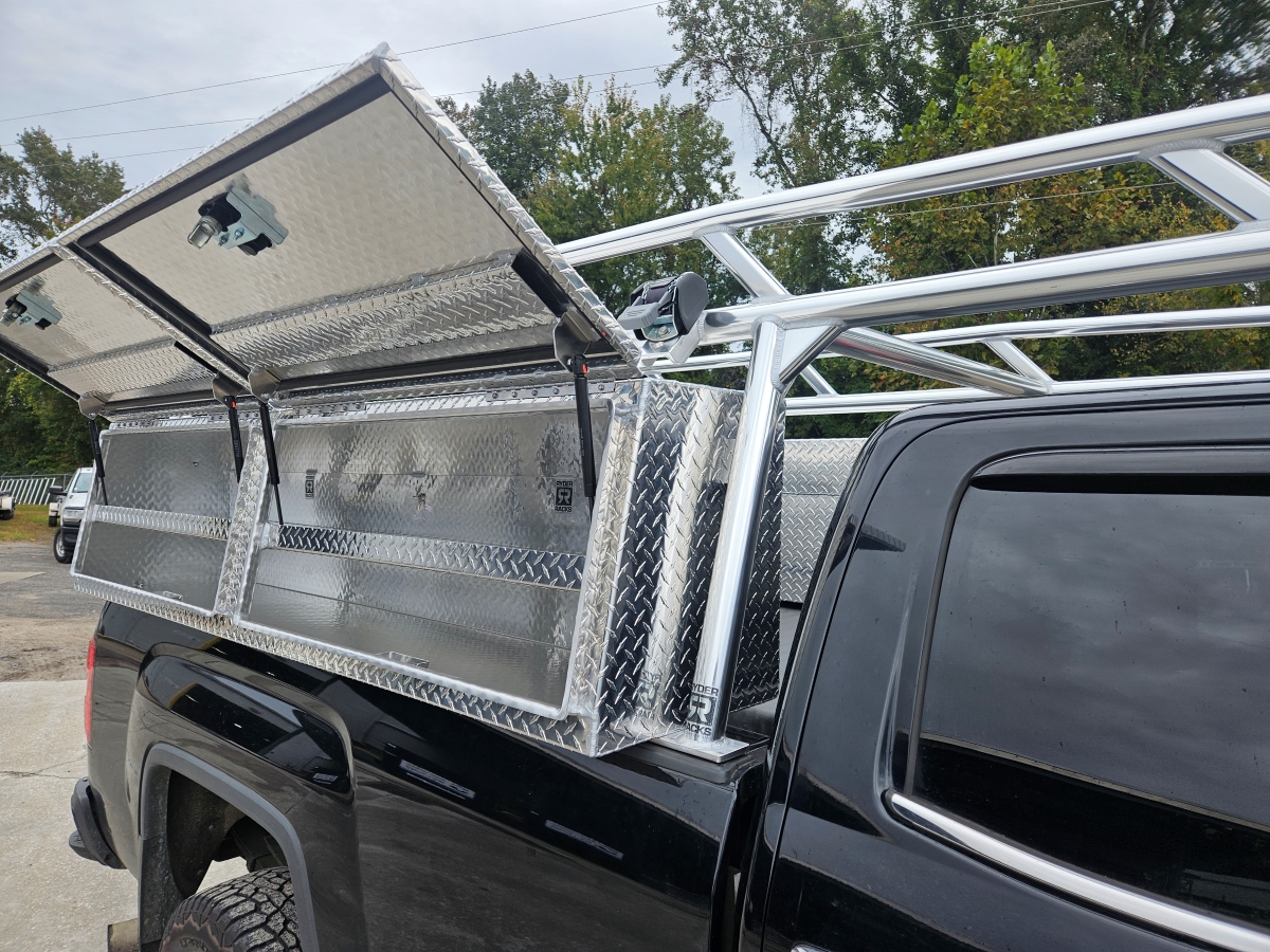 Open topsider toolbox showing interior on black pickup.