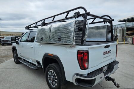 Rear three-quarter view showing the Pro Series ladder rack and XL topsider tool boxes