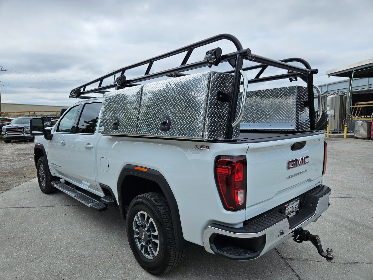 Rear three-quarter view showing the Pro Series ladder rack and XL topsider tool boxes
